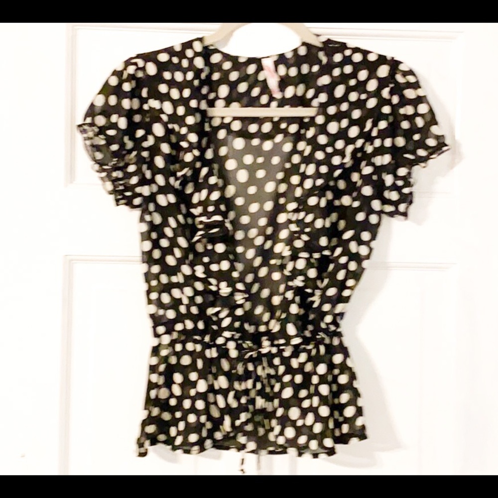 Black/white polka dot blouse w/ ruffles.